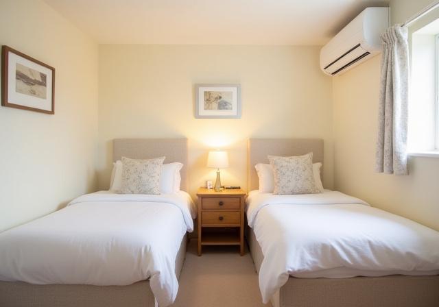 Cozy guest bedroom with two twin beds.